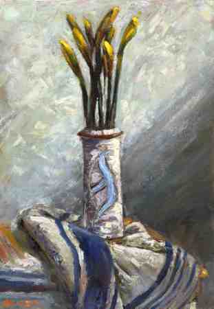 Still life of a vase with daffodils with light falling on the wall behind
